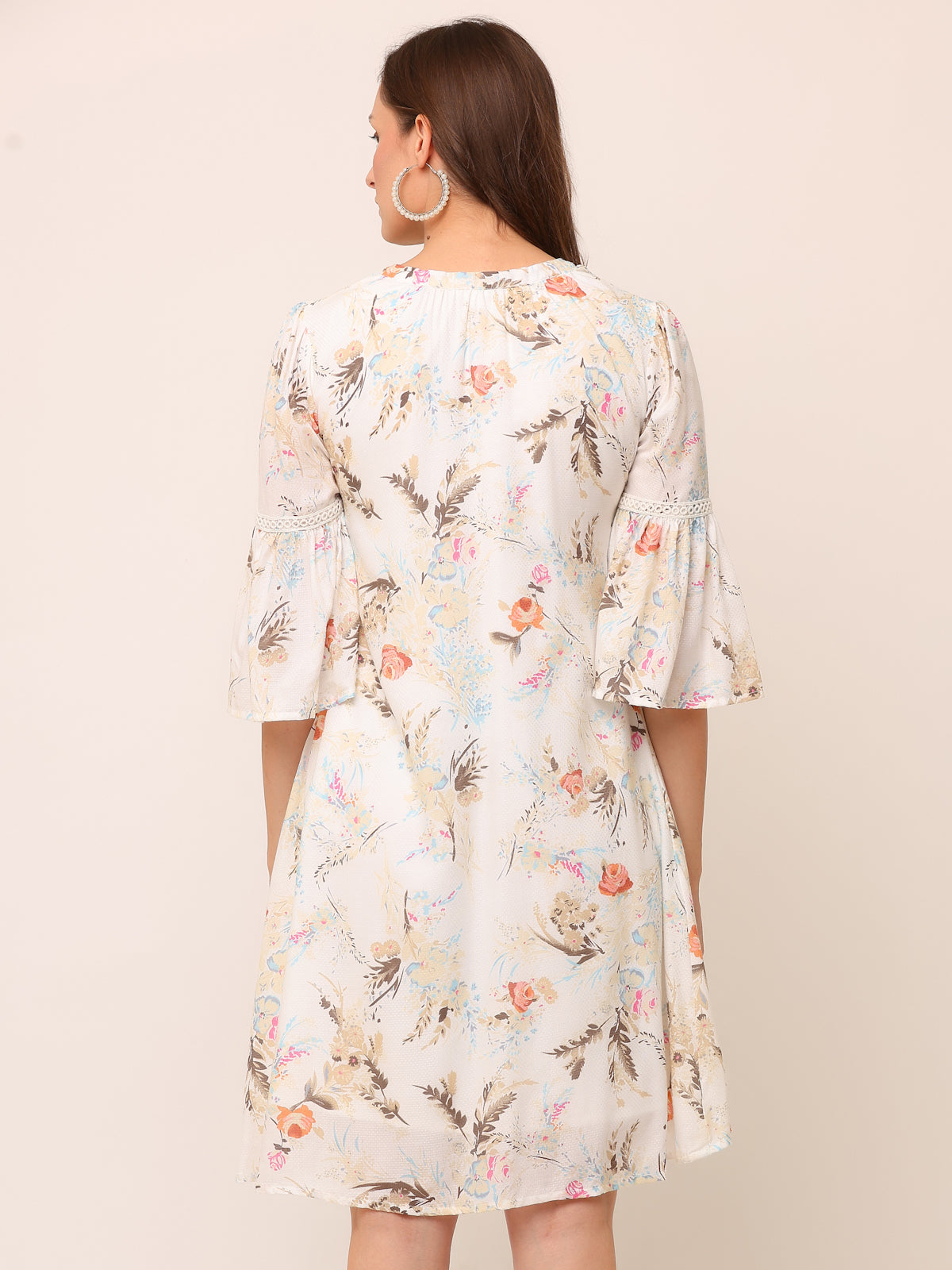 Off white Floral Textured Rayon Dress with colorful tassels