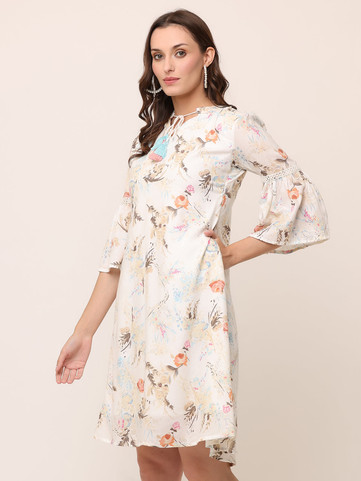 Off white Floral Textured Rayon Dress with colorful tassels