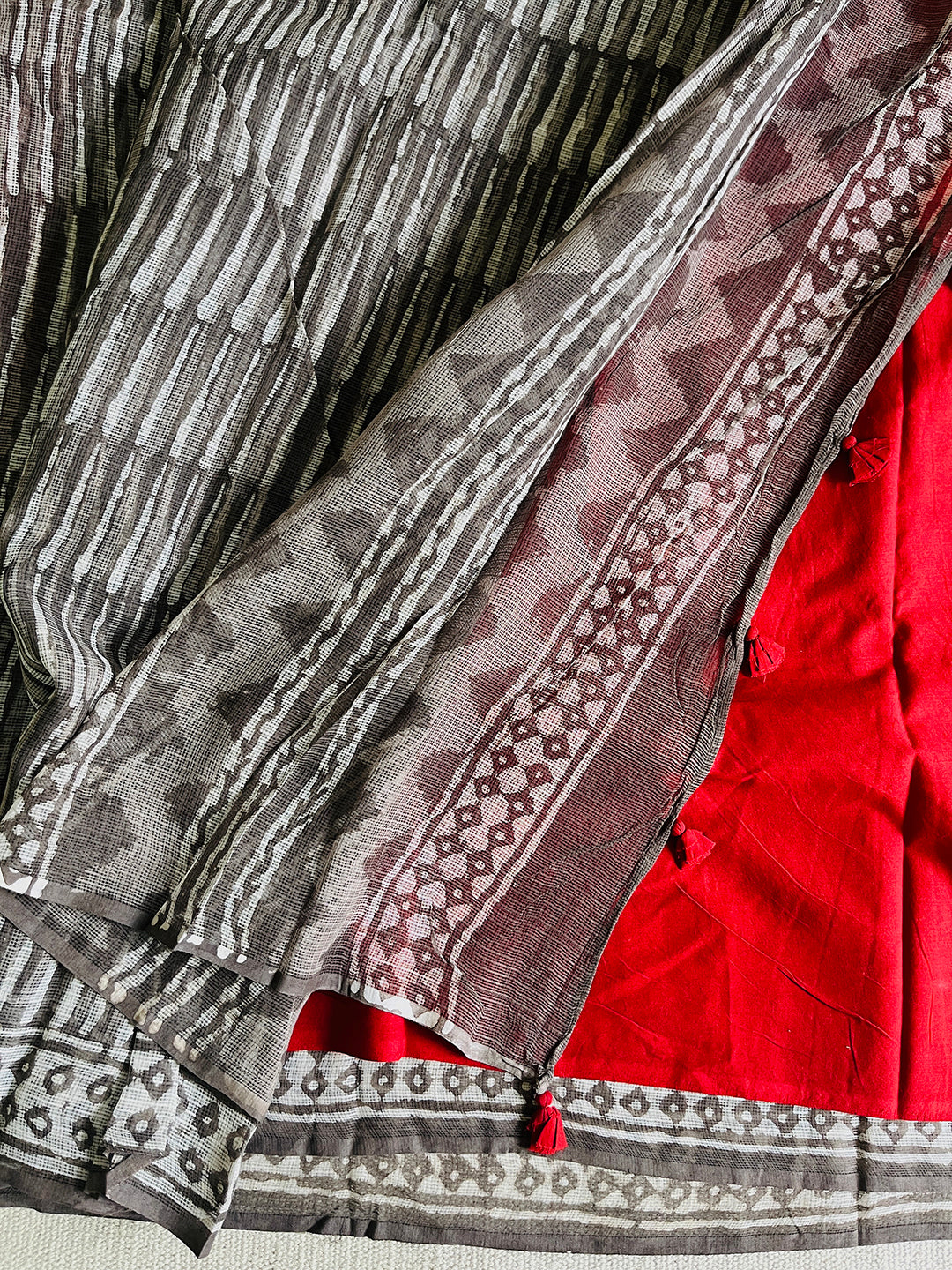 "CHASE THE WAVES" CHARCOAL KOTA DORIA SAREE  (RED TASSELS)