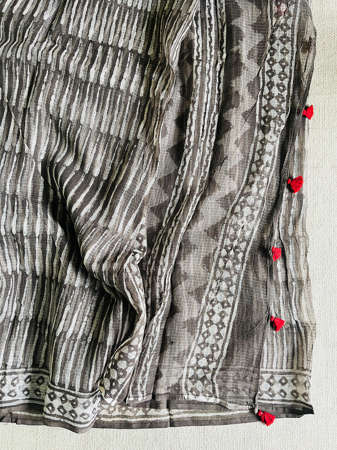 "CHASE THE WAVES" CHARCOAL KOTA DORIA SAREE  (RED TASSELS)