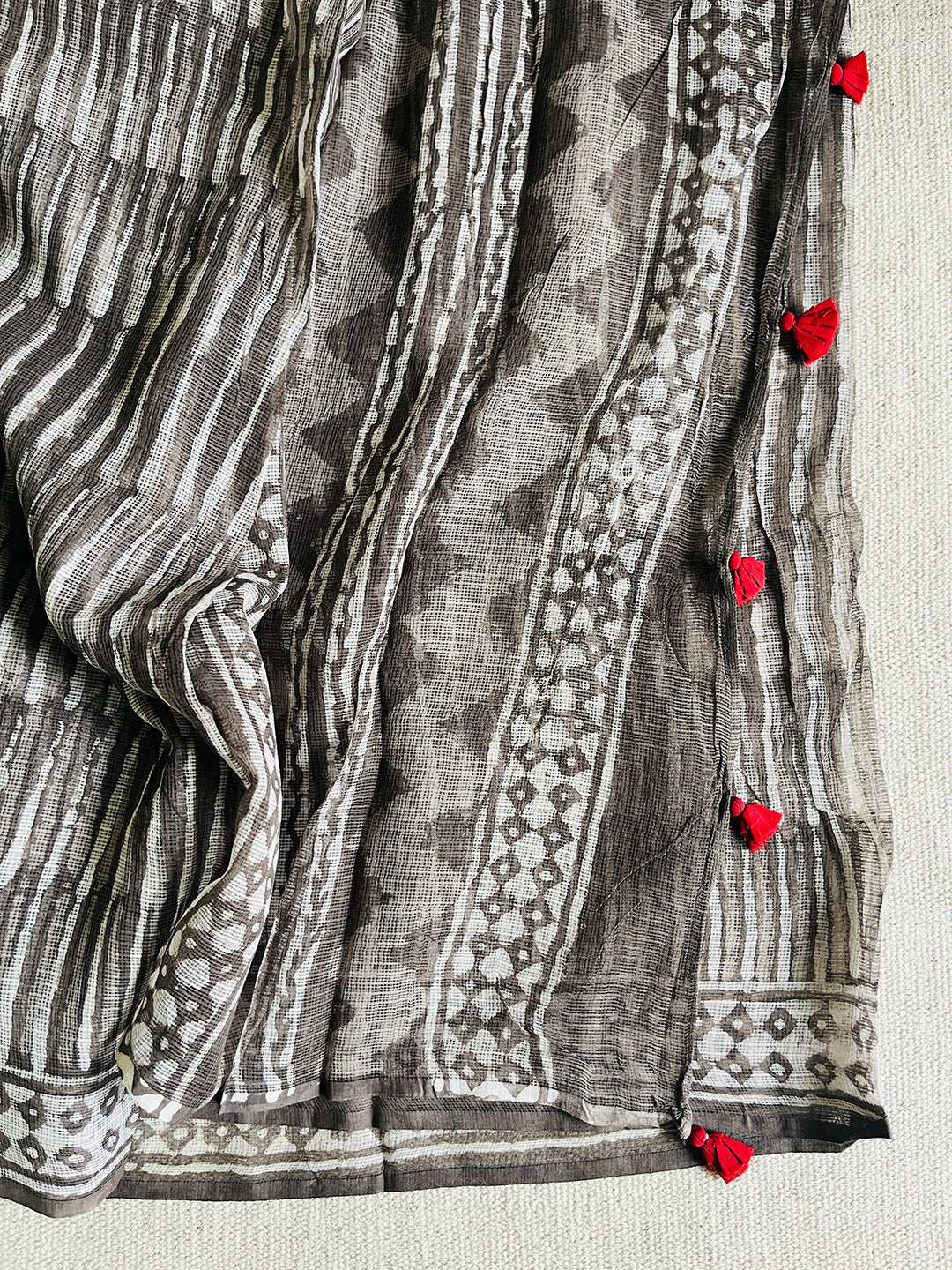 "CHASE THE WAVES" CHARCOAL KOTA DORIA SAREE  (RED TASSELS)