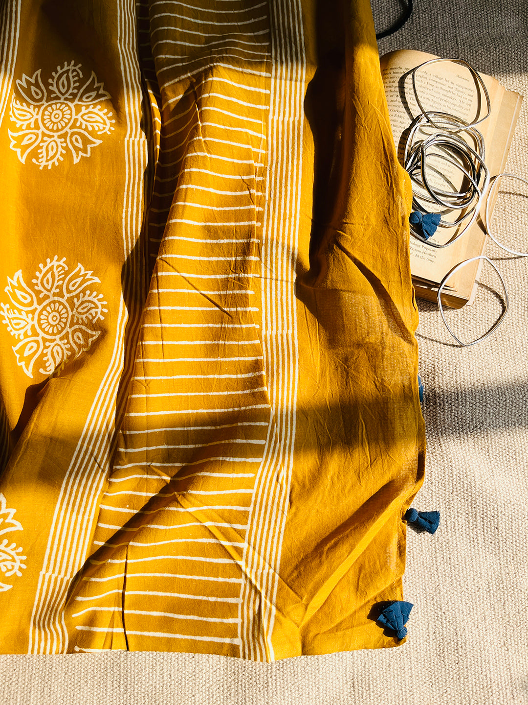 MUSTARD BLOCK PRINTED TASSELED MULMUL SAREE