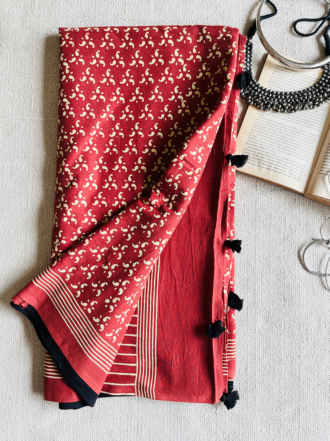 EARTHY-RED BLOCK PRINTED TASSELED MULMUL SAREE