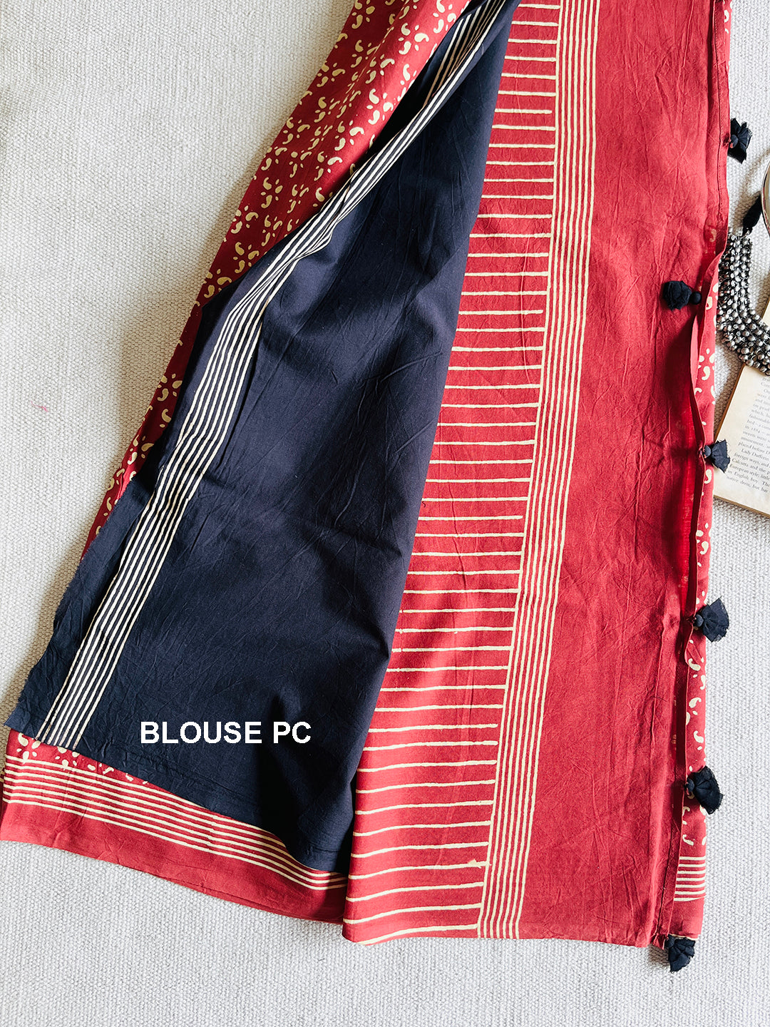 EARTHY-RED BLOCK PRINTED TASSELED MULMUL SAREE