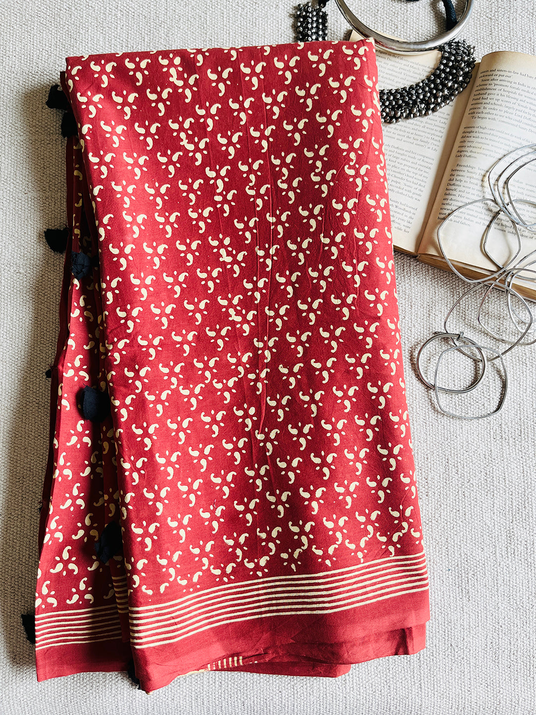 EARTHY-RED BLOCK PRINTED TASSELED MULMUL SAREE