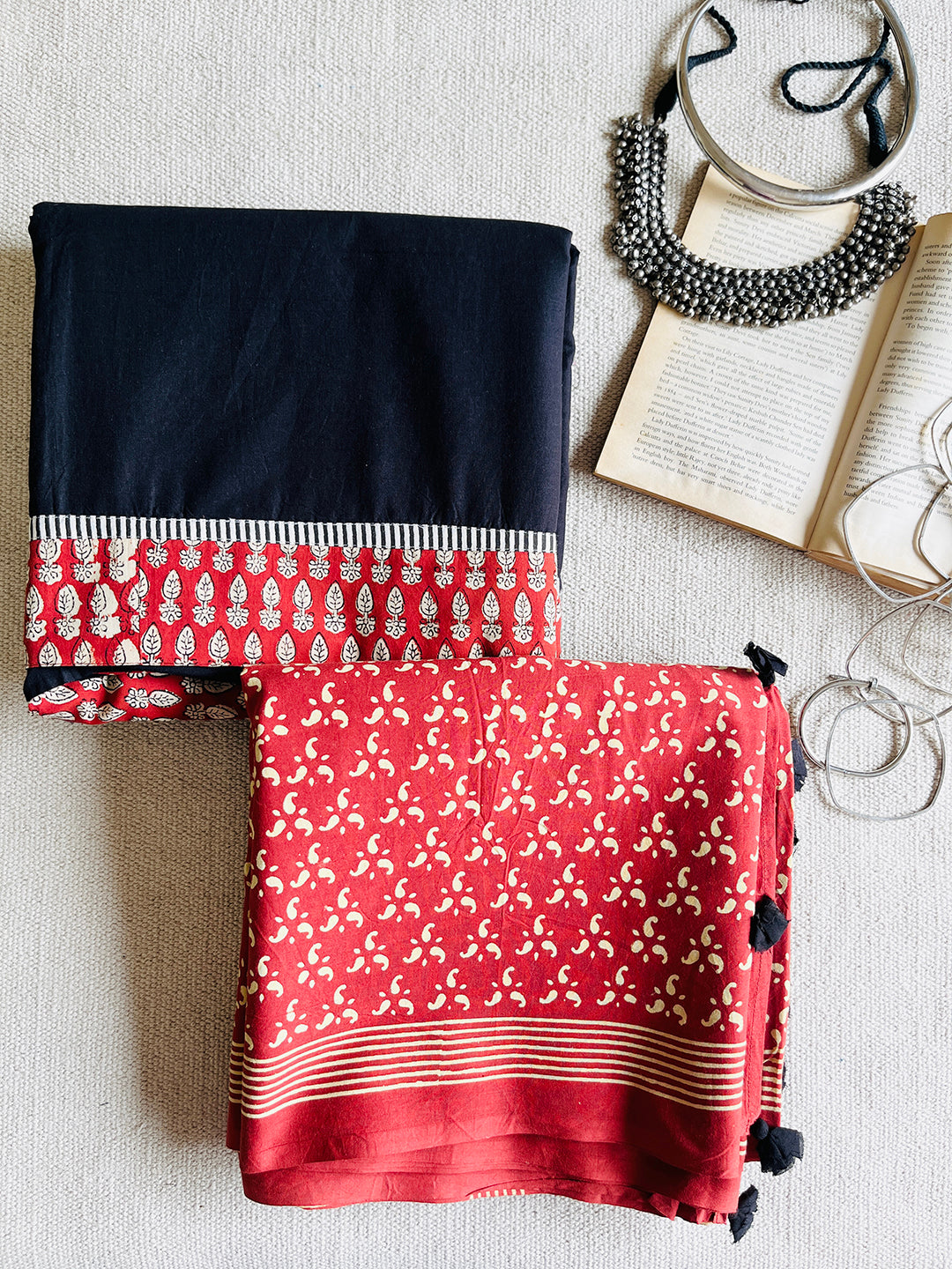 EARTHY-RED BLOCK PRINTED TASSELED MULMUL SAREE