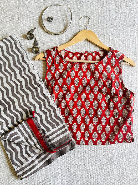 RED SIDE-BUTTON-DETAIL SLEEVELESS COTTON BLOUSE