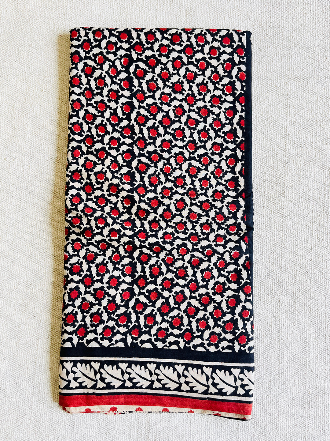 BLACK & RED ALLOVER PRINTED MULMUL SAREE