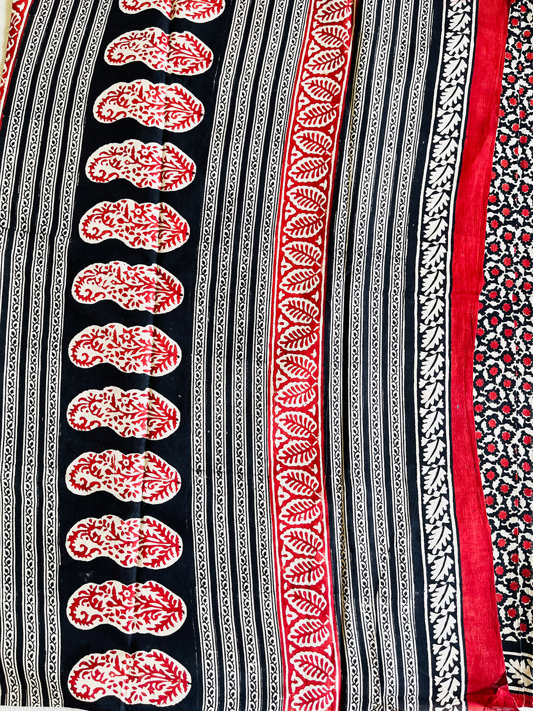 BLACK & RED ALLOVER PRINTED MULMUL SAREE
