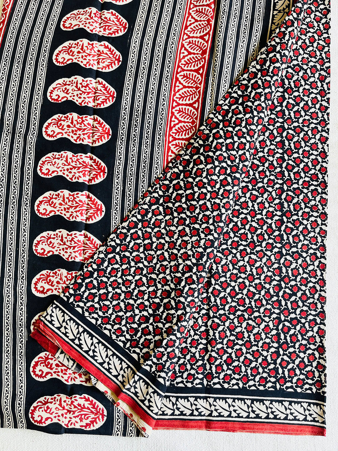 BLACK & RED ALLOVER PRINTED MULMUL SAREE